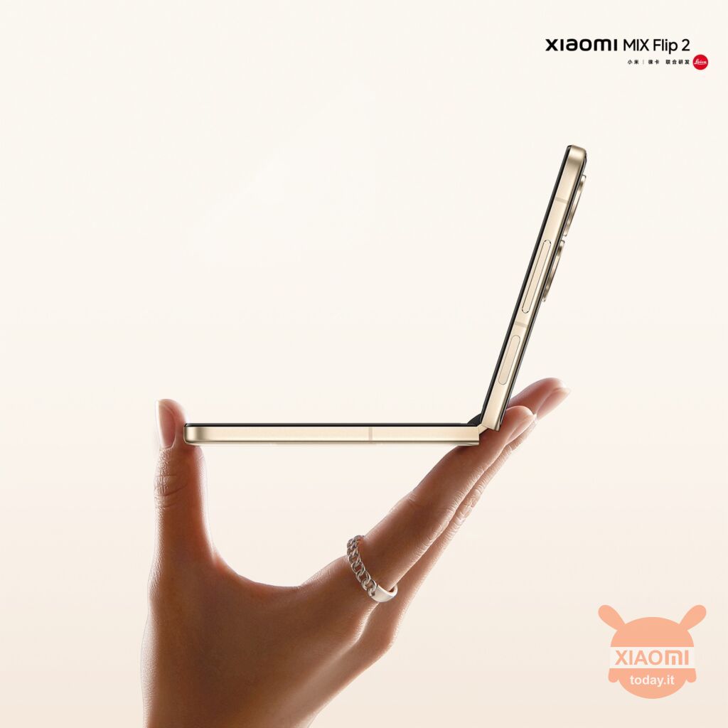 xiaomi mix flip 2 seen from the side, therefore in profile and open, held by one hand